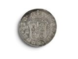 an old silver coin with a coat of arms on it