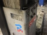 a machine that is sitting on a pallet in a warehouse