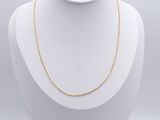 a white mannequin with a gold chain on it