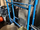 a blue cart with a bunch of items inside of it