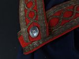 a close up of a jacket with a button on it