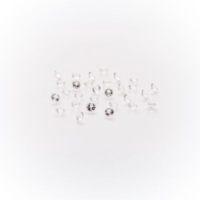 a bunch of white diamonds on a white surface