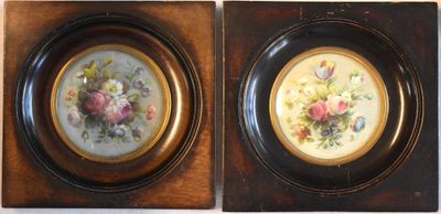 two framed pictures of flowers on the wall