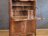 an old wooden desk with drawers and drawers on top of it
