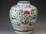 an image of a vase with flowers and birds on it