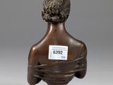 a bronze bust of a man with a beard on a pedestal