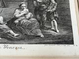 an old picture of a woman holding a baby in her lap