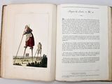 an open book with a picture of a woman and a dog