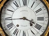 a clock with roman numerals on the face of it