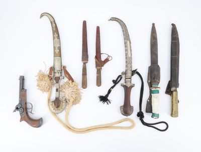 many different types of knives on a white surface