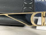 a close up of a black purse with a gold buckle on it