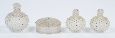three white vases with a cactus plant in them on a white surface