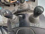 an image of a close up of a car ' s steering controls