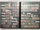 many different stamps on the pages of a book