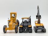 two toy vehicles that are sitting next to each other