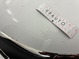 a ruler on the hood of a vintage car