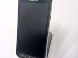 a cell phone that is sitting on top of a stand