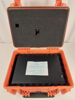 an orange and black case with a note inside of it