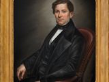 portrait d'un homme en costume noir et chemise blanche