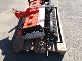 a small machine that is sitting on a pallet in the street