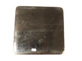 a small square metal object on a white surface
