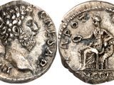a silver coin with an image of a man on a horse