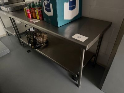 a metal table with a blue box on top of it