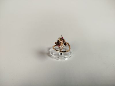 an image of a ring with a red stone in it