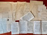 several old papers and papers are on a red surface