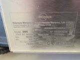 a picture of a stainless steel box with a label on it