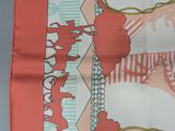 a red and white scarf with a picture of a cat and dog on it