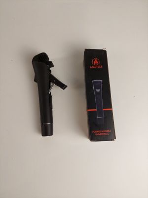 a black hair dryer and a box on a table