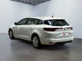 a picture of a white car parked in a showroom