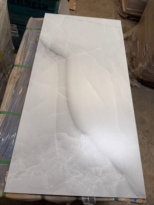 a large white marble slab on a pallet in a warehouse