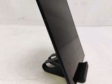 a tablet that is sitting on a stand on the table