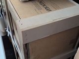 several boxes of books are stacked on top of each other