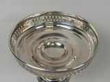 a silver plate that is sitting on a table