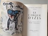 an open book with a drawing of a man on it