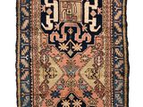 a blue and red rug with a design on it