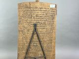 a wooden plaque with writing on it and a hammer on top of it