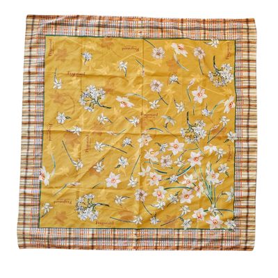 a close up of a yellow handkerchief with flowers on it