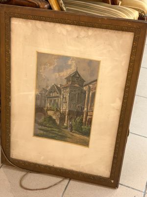 une photo d'une photo représentant une maison, dans un cadre