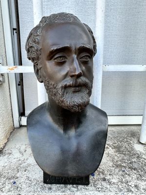 a bust of a man with a beard and a mustache