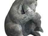 a statue of a bear holding a teddy bear in its paws