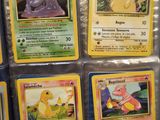 a lot of pokemon cards on display on the table
