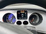 a close up of a car dashboard with various gauges