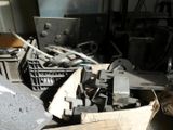 a pile of tools sitting on the floor in a room