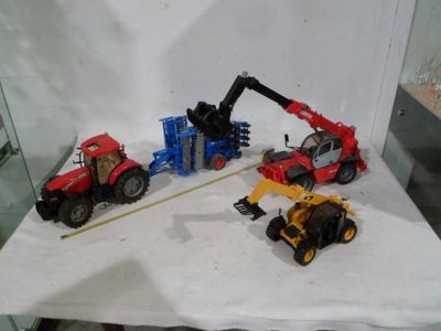 three toy vehicles that are sitting on a table