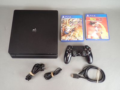 a video game console and a game controller on a table