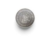 a close up of a coin on a white surface with a white background